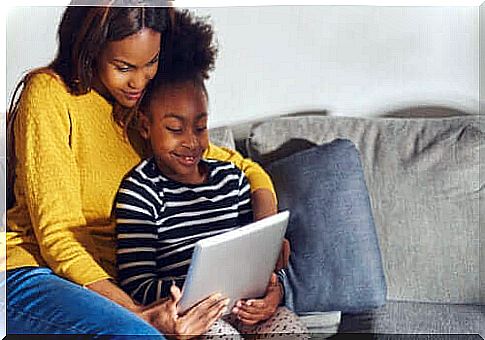 Mother and daughter playing with an educational app