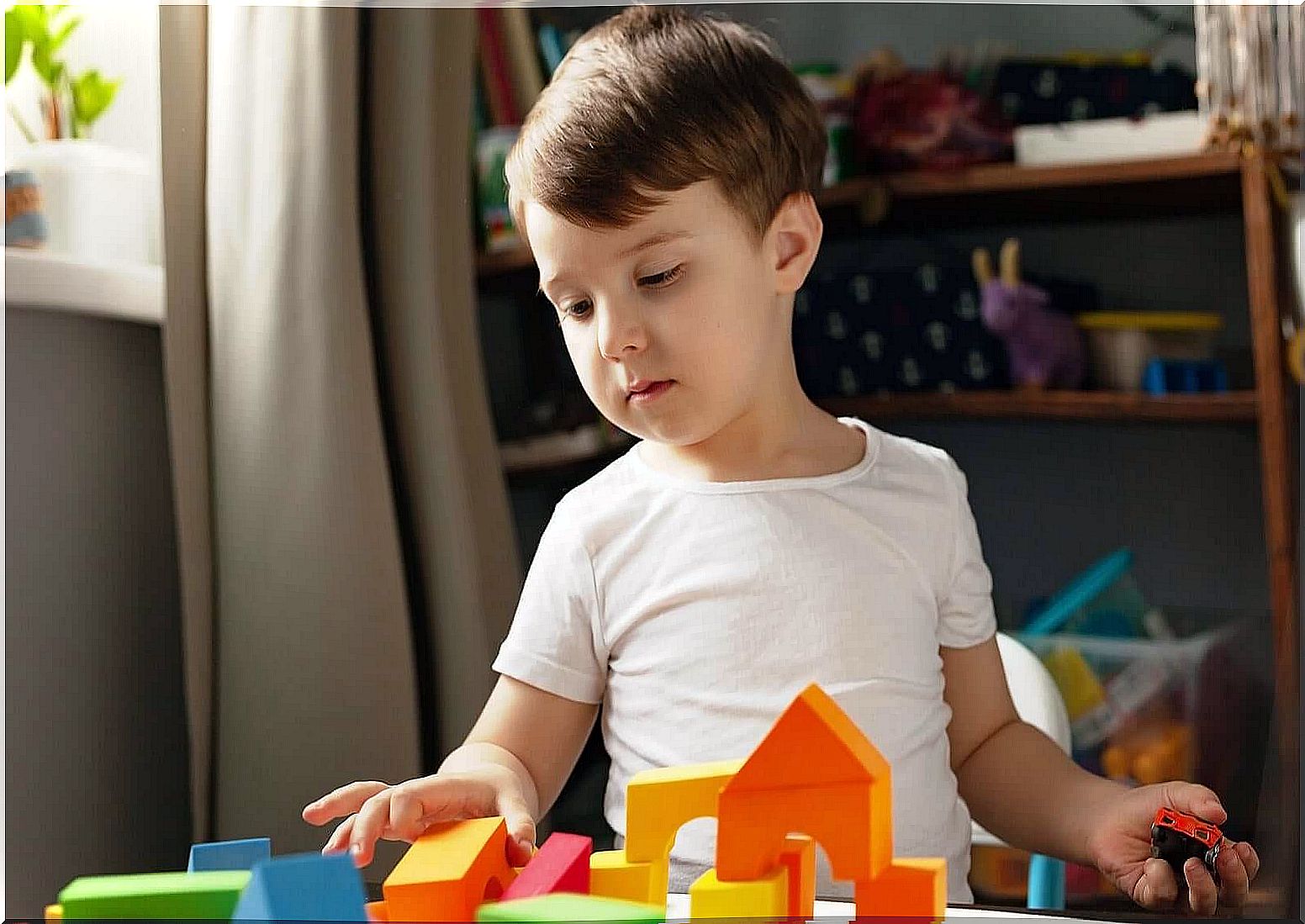 A child playing with building blocks.