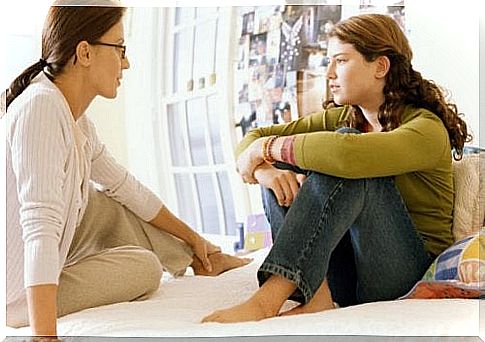 Mother and daughter in bed talking