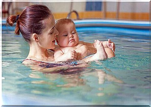 Mother and baby in the pool