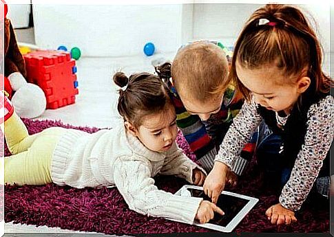 Kids playing on a tablet