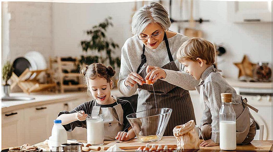 A grandmother who bakes with her young grandchildren.