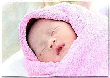 Baby in pink blanket