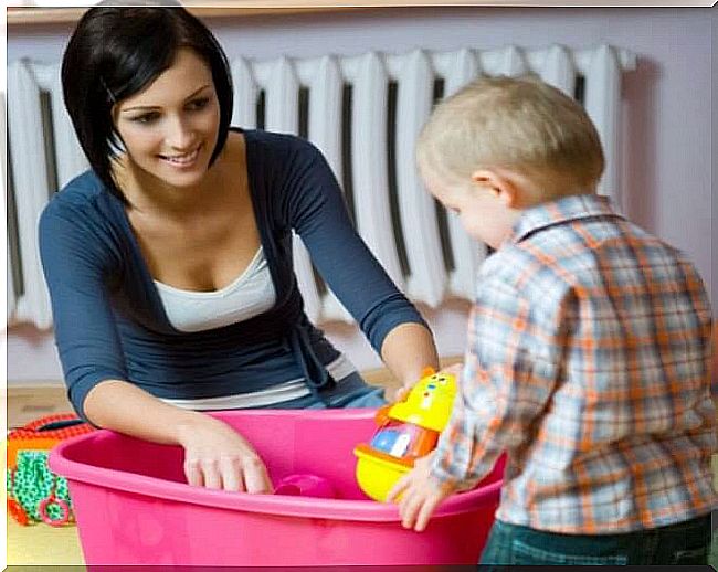 Child cleans up toys