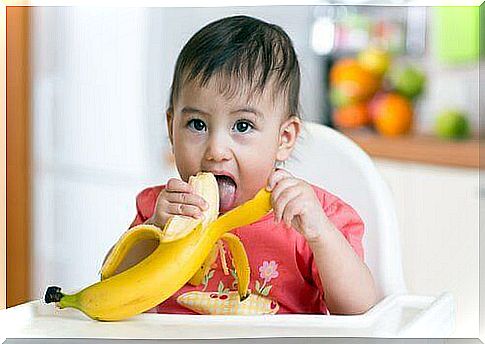 Girl eats a banana