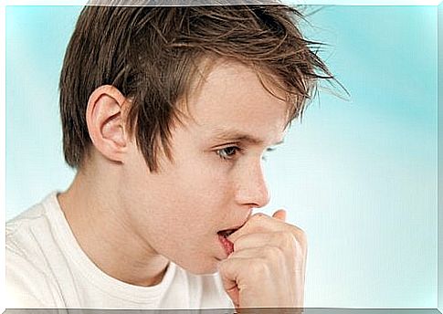 Boy biting his nails