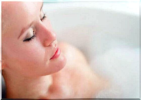 Woman is relaxing in the bath