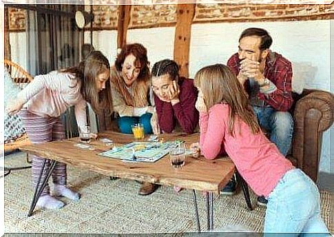 Family playing a board game