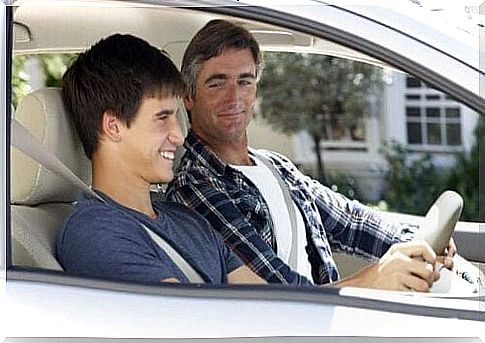 Father teaches son to drive