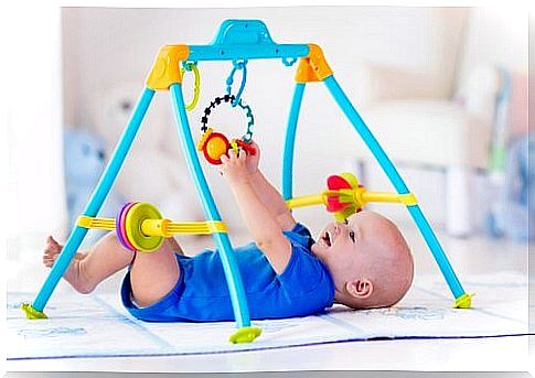 Baby plays on play mat