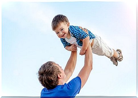 Godfather lifts godchild up