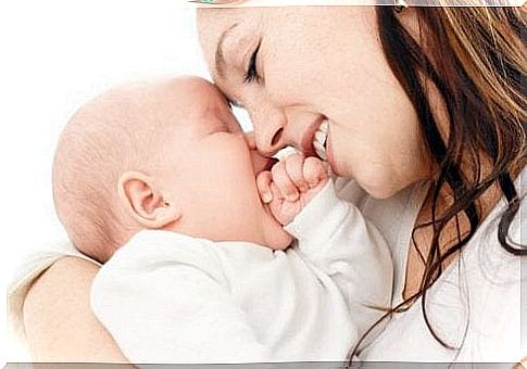 Mother smiling at baby