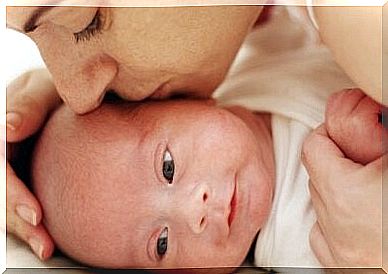 The stage of labor - hugging newborn baby