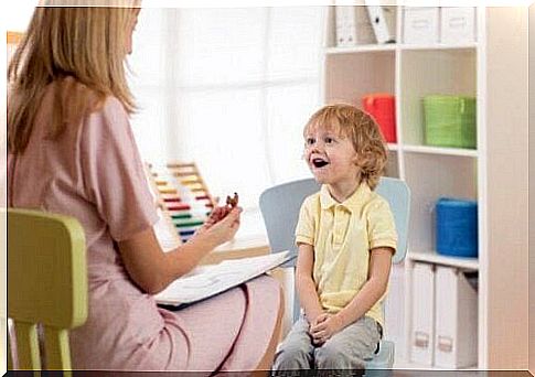 Psychologist talks to boy who is happy