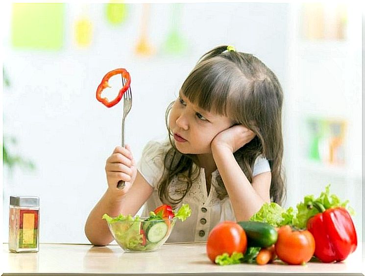 Child with bell pepper