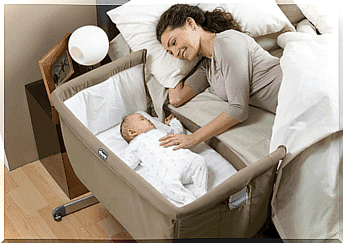 mom and baby sleep together in the bedroom