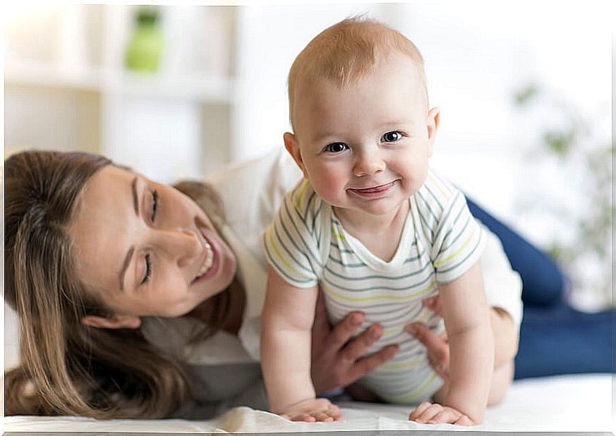 smiling mother and baby